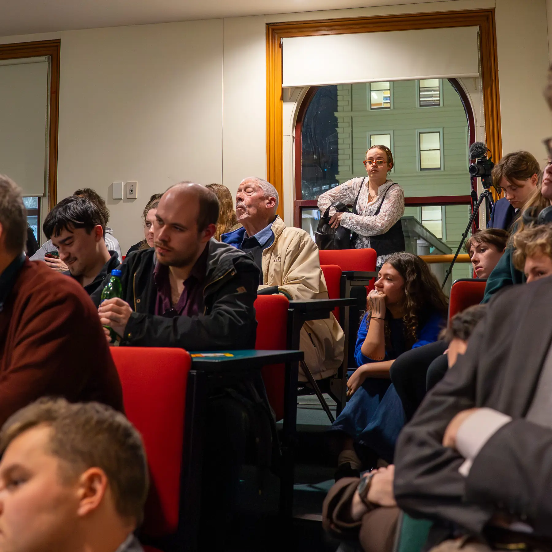 Close event frame with microphone and seated audience